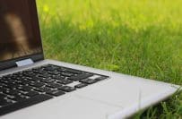 laptop sitting in grass